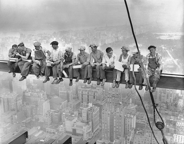 Workers atop beam skyscraper New York